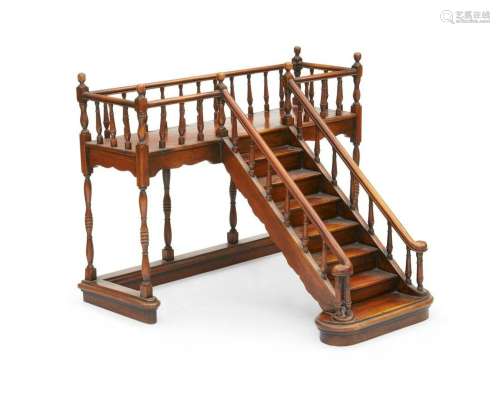 A walnut model of a staircase and landing