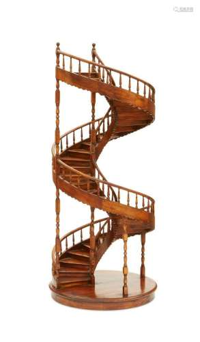 A large walnut model of a spiral staircase