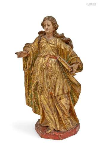 A Baroque model of a female saint holding a book