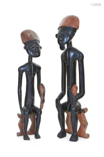 Two African tribal ebonized wood seated figures