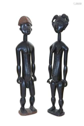 A pair of African tribal ebonized wood figures