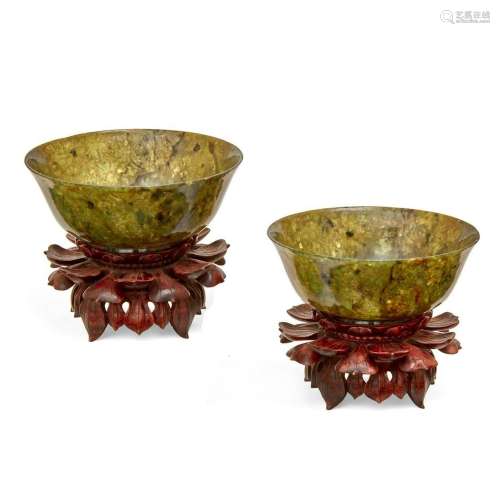 A pair of Chinese green hardstone bowls