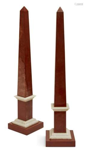 A pair of red & white marble obelisks