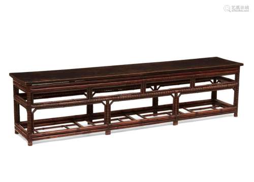 A Chinoiserie ebonized bamboo and hardwood bench
