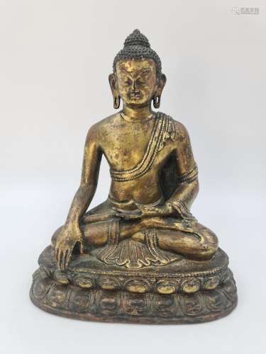 Statuette en bronze représentant Bouddha assis sur une fleur...