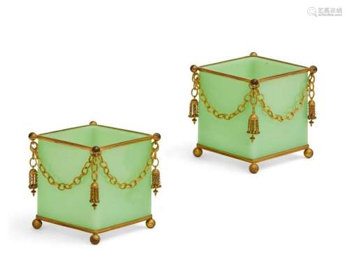 A pair of green opaline glass jardinieres