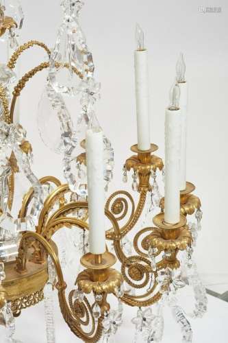 A Louis XVI style bronze and glass chandelier
