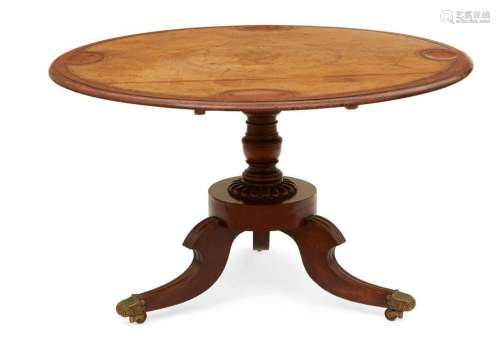 A Regency mahogany tilt top games table