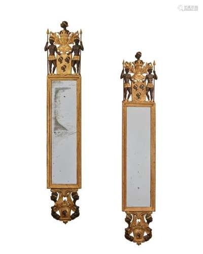A pair of Italian giltwood heraldic pier mirrors