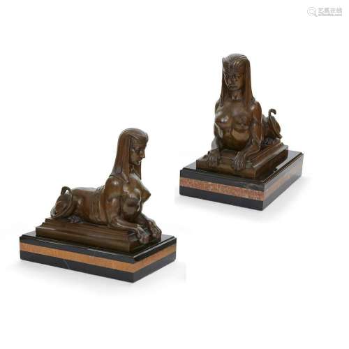 A pair of Continental bronze and marble sphinxes