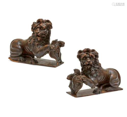 A pair of English oak models of heraldic lions