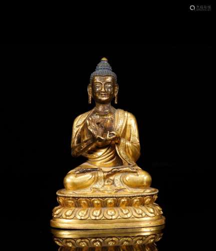 The statue of Sakyamoni in bronze gilt of Qing dynasty