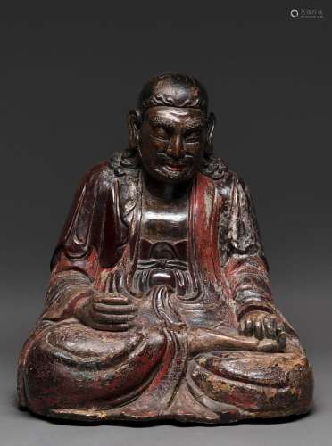 A CHINESE POLYCHROME LACQUER ON WOOD FIGURE OF A LUOHAN, MIN...