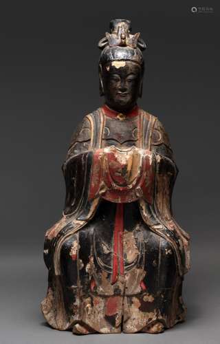 A CHINESE LACQUER ON WOOD CARVED DAOIST SEATED FIGURE, QING ...