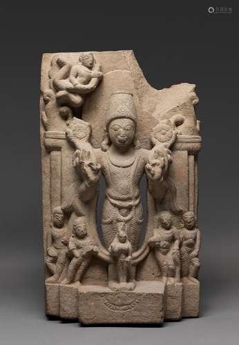 AN INDIAN STONE CARVED STANDING FIGURE OF SURYA, 12TH-13TH C...