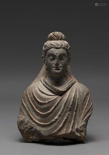 A STONE CARVED GANDHARAN BUST OF A BUDDHA, 2ND/3RD CENTURY