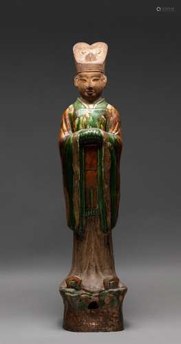 A CHINESE LARGE SANCAI-GLAZED POTTERY FIGURE OF AN OFFICIAL,...