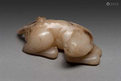 A CHINESE PALE WHITE JADE CARVED DOG