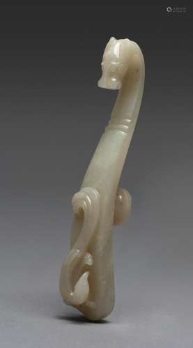 A CHINESE PALE WHITE JADE 'DRAGON' BELT HOOK HAN DYN...