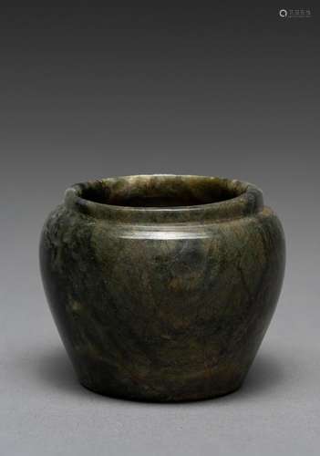 A CHINESE SMALL GREEN JADE WASHER, SONG DYNASTY (907-1279)