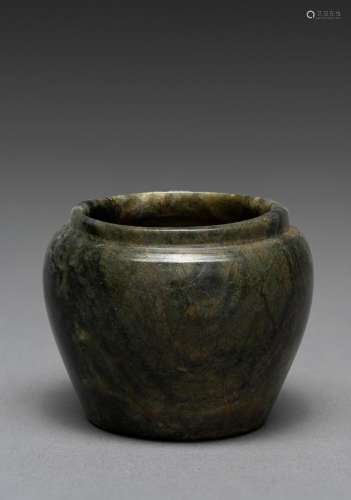 A CHINESE SMALL GREEN JADE WASHER, SONG DYNASTY (907-1279)
