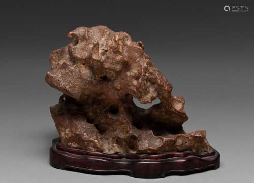 A CHINESE RED TAIHU SCHOLAR'S ROCK