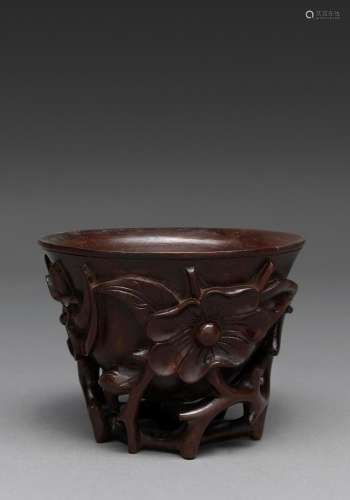 A CHINESE CARVED WOOD LIBATION CUP, QING DYNASTY, 19TH CENTU...