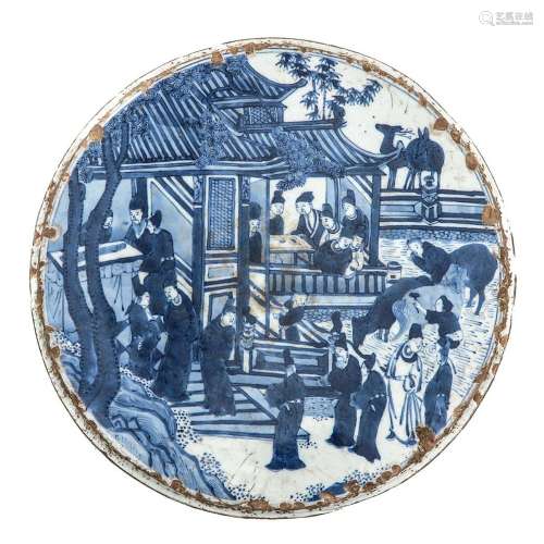 A Blue and White Round Tile