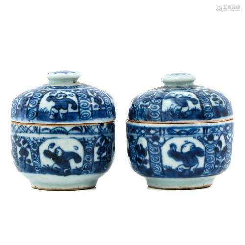 A Pair of Small Blue and White Jars with Covers