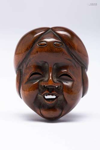 A JAPANESE BOXWOOD MASK NETSUKE OF OKAME MEIJI ERA, 19TH CEN...