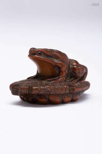 A JAPANESE BOXWOOD NETSUKE OF A FROG BY ISSAI MEIJI ERA, 19T...