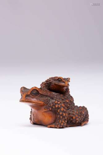 A JAPANESE BOXWOOD NETSUKE OF TWO TOADS MEIJI ERA, 19TH CENT...