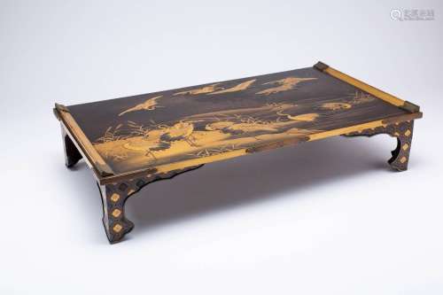A JAPANESE GOLD AND BLACK LACQUER BUNDAI (WRITING TABLE) MEI...