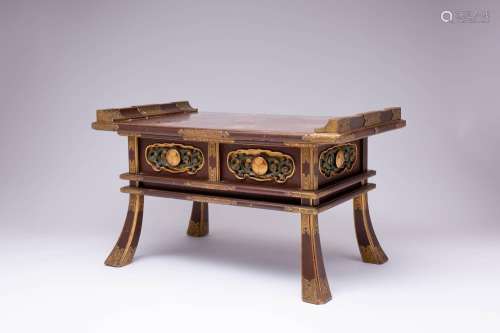 A JAPANESE BUDDHIST GOLD AND BLACK LACQUER ALTAR SUTRA TABLE...