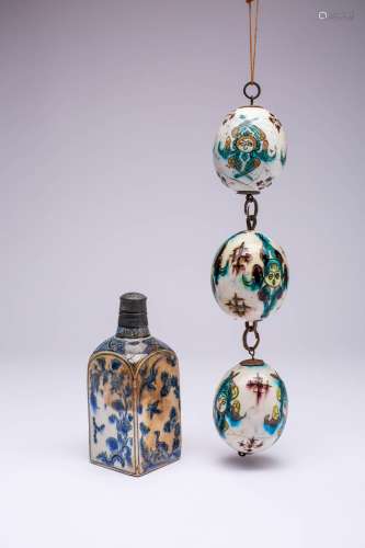 THREE KUTAHYA HANGING ORNAMENTS AND A FLASK 19TH CENTURY All...
