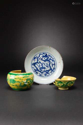 A CHINESE BLUE AND WHITE DISH AND TWO YELLOW-GROUND AND GREE...