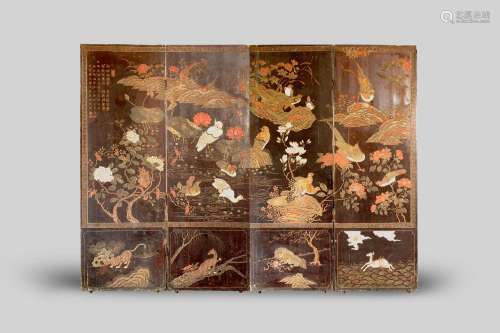 A CHINESE LACQUERED WOOD FOUR-FOLD SCREEN PROBABLY MING DYNA...