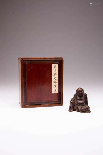A CHINESE CARVED WOOD FIGURE OF LIU HAI QING DYNASTY Depicti...