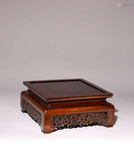 A CHINESE HARDWOOD RETICULATED WOOD STAND 20TH CENTURY The s...