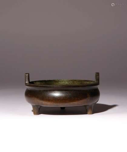 A CHINESE BRONZE TRIPOD INCENSE BURNER QING DYNASTY OR LATER...