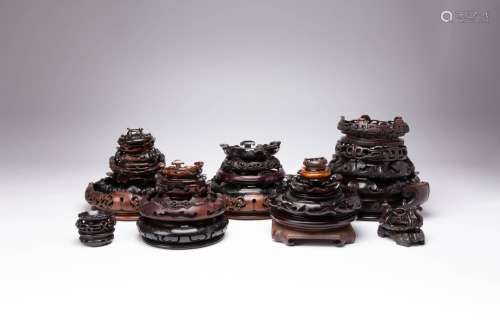 THIRTY-FIVE CHINESE WOOD STANDS 19TH AND 20TH CENTURY Of var...