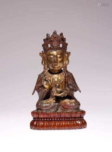 A CHINESE PARCEL-GILT BRONZE FIGURE OF GUANYIN MING DYNASTY ...