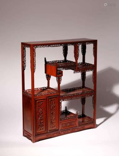 A CHINESE HARDWOOD DISPLAY STAND 20TH CENTURY With two hinge...