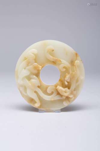 A CHINESE WHITE AND MOTTLED JADE BI QING DYNASTY OR LATER On...