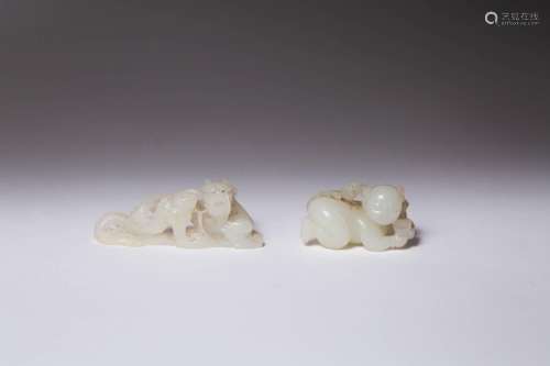 TWO CHINESE WHITE JADE CARVINGS OF A BOY AND A DRAGON QING D...