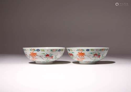 A PAIR OF FAMILLE ROSE `PEACHES AND BATS` BOWLS QING DYNASTY...