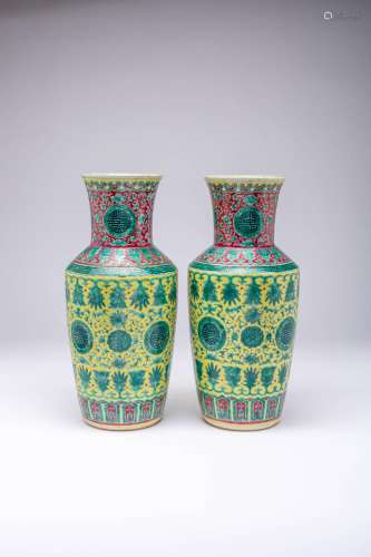 A PAIR OF CHINESE YELLOW-GROUND VASES 19TH CENTURY The taper...
