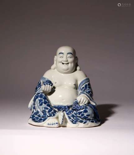 A CHINESE BLUE AND WHITE SEATED FIGURE OF BUDAI HE SHANG 20T...