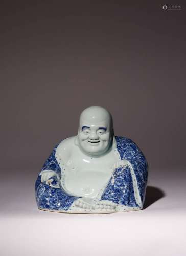 A CHINESE BLUE AND WHITE SEATED FIGURE OF BUDAI HE SHANG 20T...