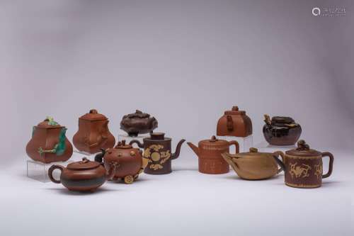 A COLLECTION OF ELEVEN CHINESE YIXING TEAPOTS AND COVERS 18T...